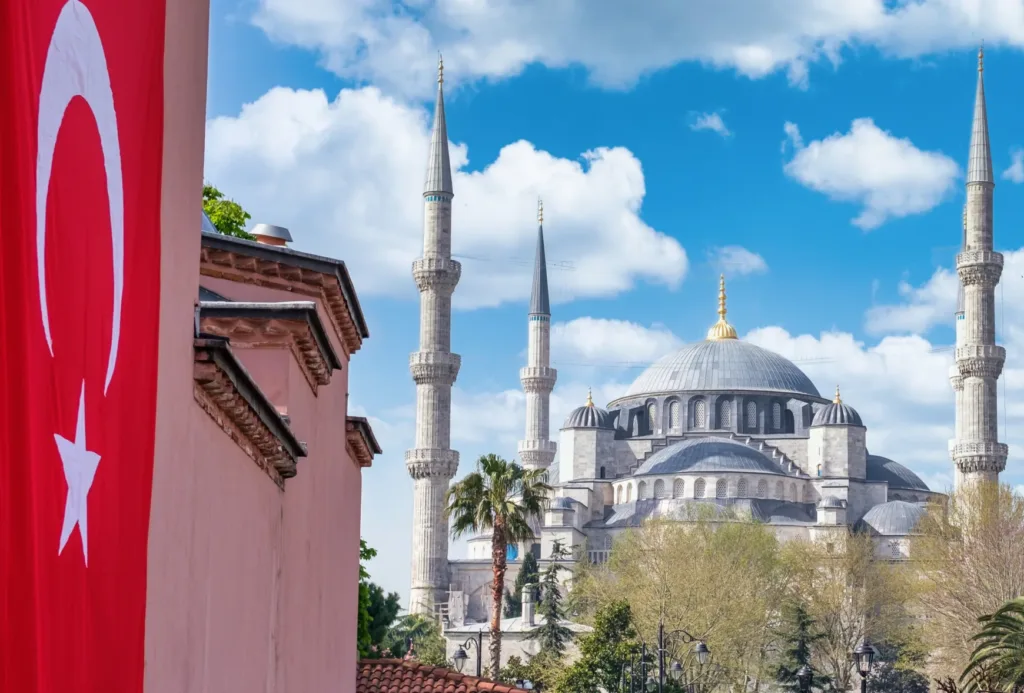 landscape turkish flag blue mosque far away scaled e1679063694963